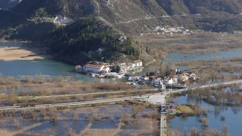 A small town surrounded by a lake Stock Footage 86953814