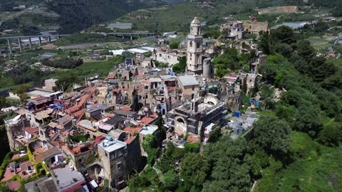 A small town is surrounded by mountains and trees Video stock 328615639