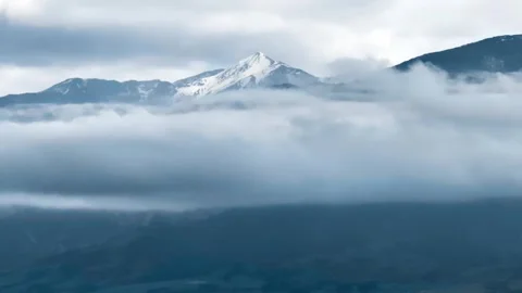 A small town surrounded by the sea and snow-capped mountains Stock Footage 260913080