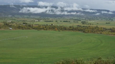 Small Town Tilt up Over Fields and Clouds. Video stock 42484349