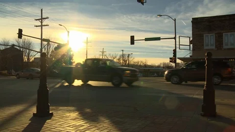 Small town traffic in evening Stock Footage 100048462