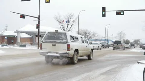 Small Town Traffic in Winter Setting with Temperture Sign -11C 스톡 동영상 10755660