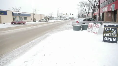 Small Town Traffic in Winter Setting Stock Footage 10755735
