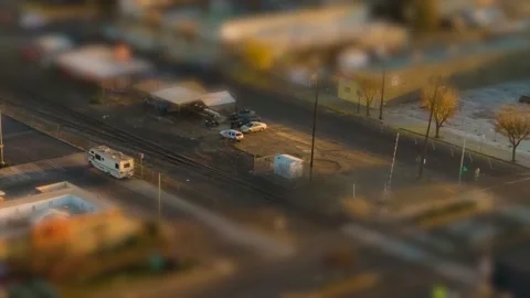 Small Town train tracks and street Hyperlapse tilt shift effect at Sunset Video stock 144648733