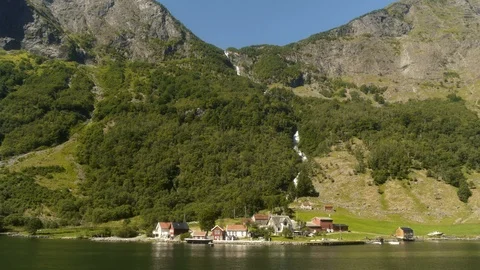 Small Town Under Huge Waterfall in the Fjords of Norway Video stock 94287327