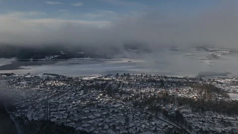 Small town in winter covered by snow aerial view scenic clouds Stock Footage 257790257
