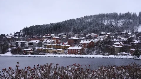 Small town in winter with mountain and forest and ski slope traffic houses Video stock 145915762