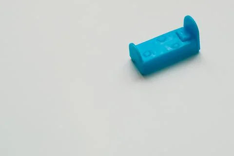 Small toy bed on the background Stock Photos