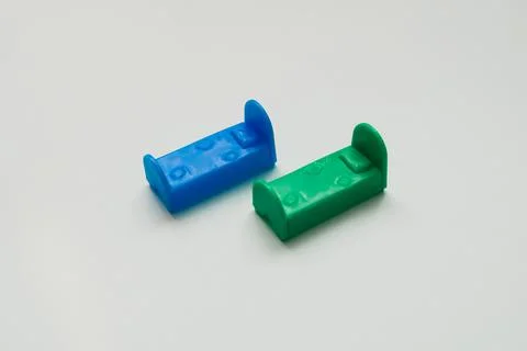 Small toy beds on the background Stock Photos