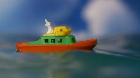 Small Toy Boat Rides The High Seas