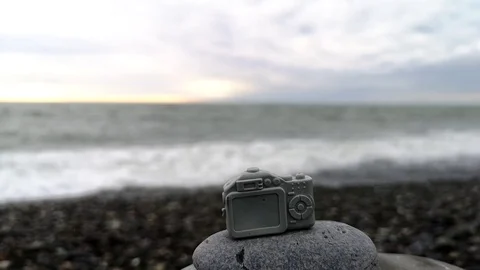 Small toy camera on the background of the sea. Stock Footage 109334500