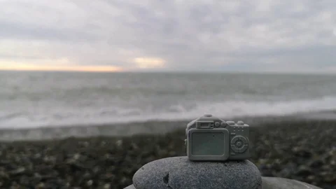 Small toy camera on the background of the sea. Stock Footage 109335334