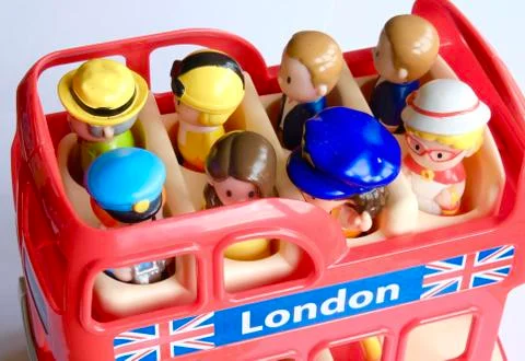 Small toy figures on a bus Foto stock
