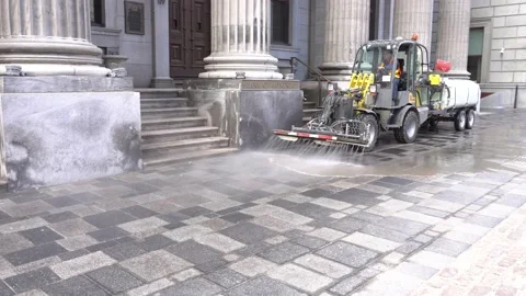 A small tractor that clean up the sidewalk 스톡 동영상 134022393