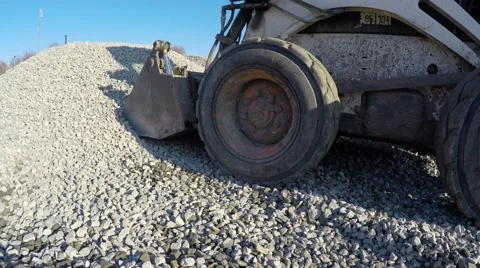 Small tractor loaded into the bucket rubble. Stock Footage 58579181