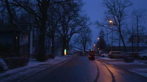 A small tractor rides to clean snow Stock Footage 267012546