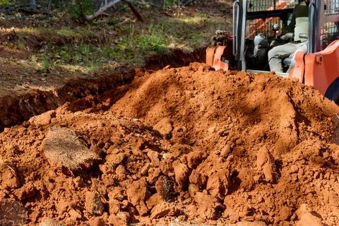 Small tractor used to move soil in a construction site or on a landscaped area Stock Photos
