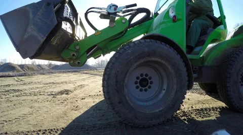 Small tractor working on the construction of the stadium. Video stock 58579401