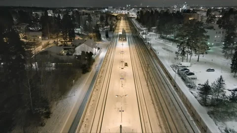 Small tractors cleaning snow off of the train station platform in Vantaa. Stock Footage 171881133