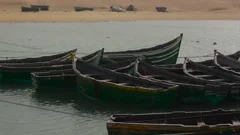 Small traditional fishing boat floating in the sea at coast with