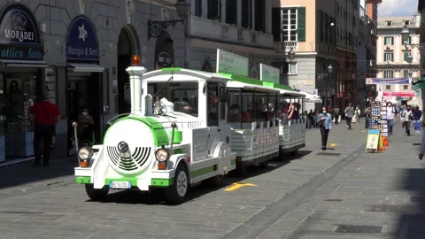 Small train for the sightseeing tour of the city of Genoa Stock Footage 162475366