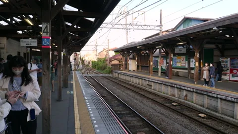 Small train station platforms in village of Kamakura. Japan. Stock Footage 247134976