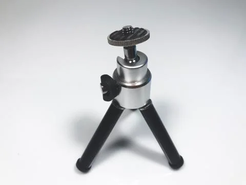 The small tripod on a grey background Stock Photos