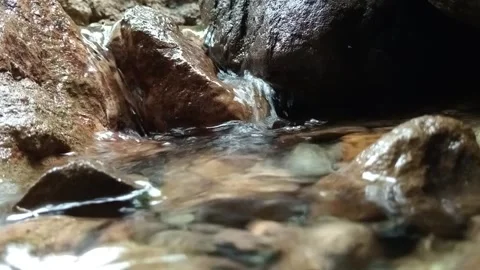 Small Tropical Jungle Waterfall Flowing Over Rocks Stock Footage 329773451