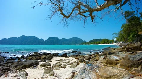 Small, Tropical Waves on a Rocky, Tropical Beach Paradise. UltraHD video Stock Footage 59795860