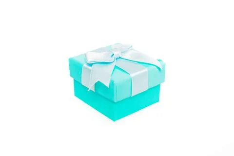 Small turquoise gift box with a white ribbon and bow, isolated on a white Stock Photos