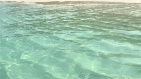 Small turquoise ocean waves and white sand on tropical beach Stock Footage 306041282