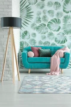 Small turquoise sofa Stock Photos