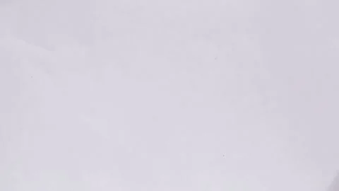 A small turtle is crawling on a white sheet. Stock Footage 137104655