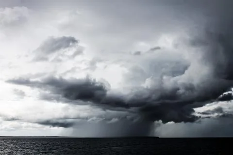 A small typhoon with heavy rain evolving at open sea Stock Photos