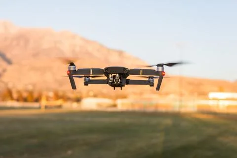 Small unmanned drone hovering Stock Photos