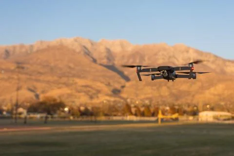 Small unmanned drone hovering Stock Photos