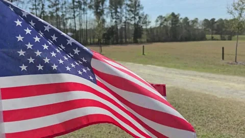Small US Flag on Blue Sky Normal Speed Stock Footage 304636024