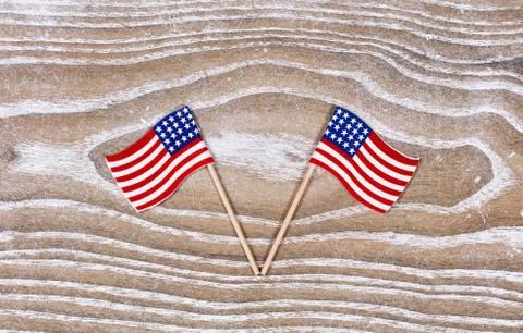 Small USA flags on white rustic wooden boards Stock Photos