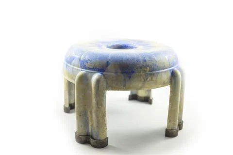 Small used blue plastic stool for kids isolated on white. Stock Photos