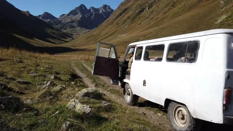 A small van in the middle of impenetrable mountains Video stock 144869005