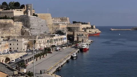 Small vessels dock alongside in harbor Stock Footage 108608924