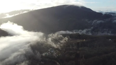 Small village against the backdrop of mountains Stock Footage 246946495