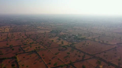 A small village and empty field in Rajasthan india Stock Footage 231667633