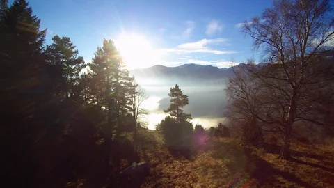 Small village and a sea of clouds over a valley, mountains, rising sun. Stock Footage 101978153