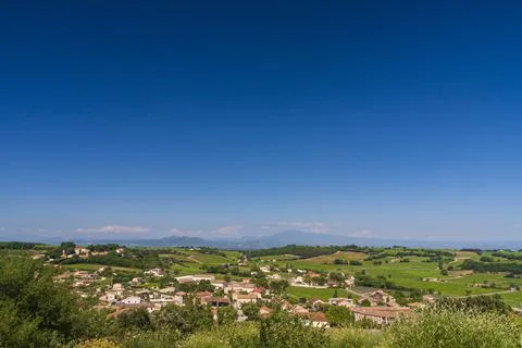 A small village with green fields Stock Photos