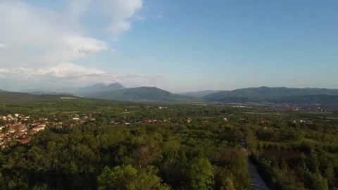 Small village with mountains in the background Stock Footage 248162161