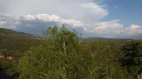 A small village with mountains in the background Stock Footage 248162241