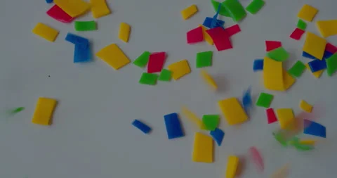 Small vivid plastic pieces prepared for recycling purposes. Stock Footage 327878155