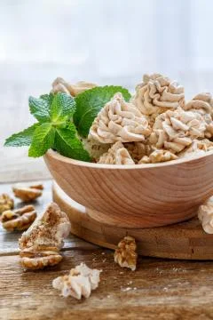 Small walnut meringue and mint. Stock Photos