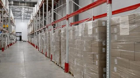 Small warehouse with boxes and plastic containers. Plastic trays and cardbo.. Stock Photos